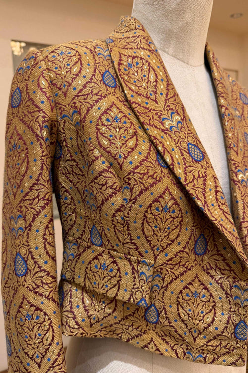 Gold with blue and rust accents