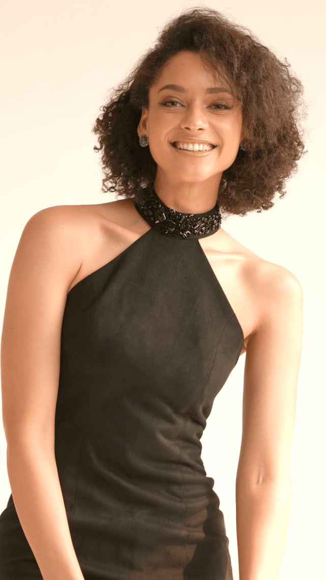 Halterneck black dress with tassels