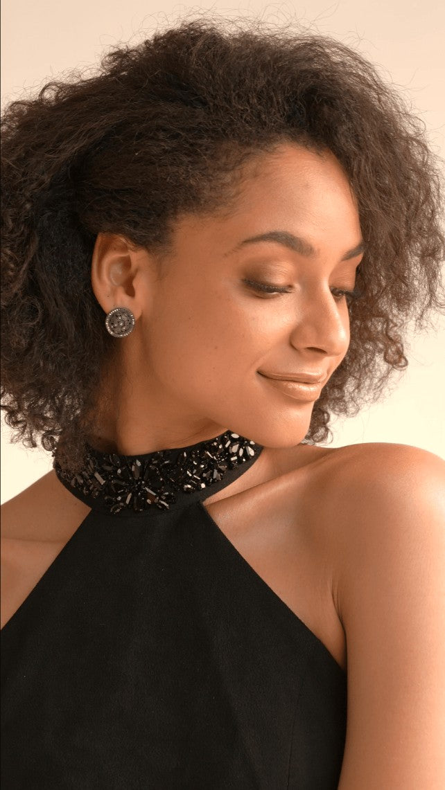 Black mini dress with tassels at the bottom by Duchess Kumari